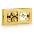 Ferrero Rocher chocolate hazelnut truffles in gold packaging, showcasing the iconic spherical shape and decorative foil.