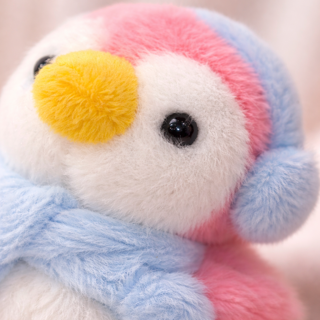 Colorful Fluffy Penguin Givana keychain with soft plush texture and cute penguin design, available in four vibrant colors.