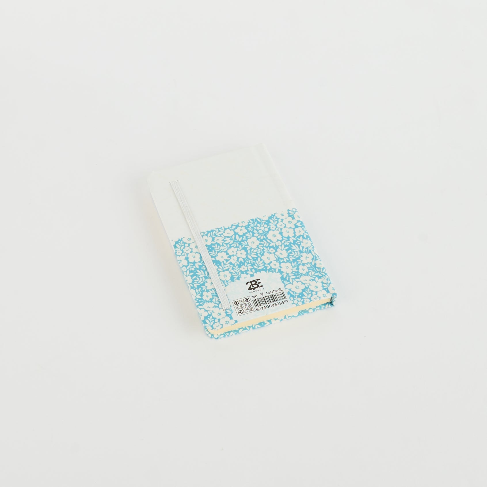 A6 floral notebook by 2BE featuring a colorful flower design on a textured cover.