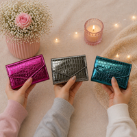 Givana glossy queen wallet in vibrant color, featuring a sleek design with multiple card slots and a secure snap closure.