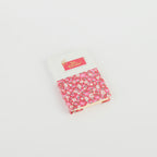A6 floral notebook by 2BE featuring a colorful flower pattern on a textured cover.