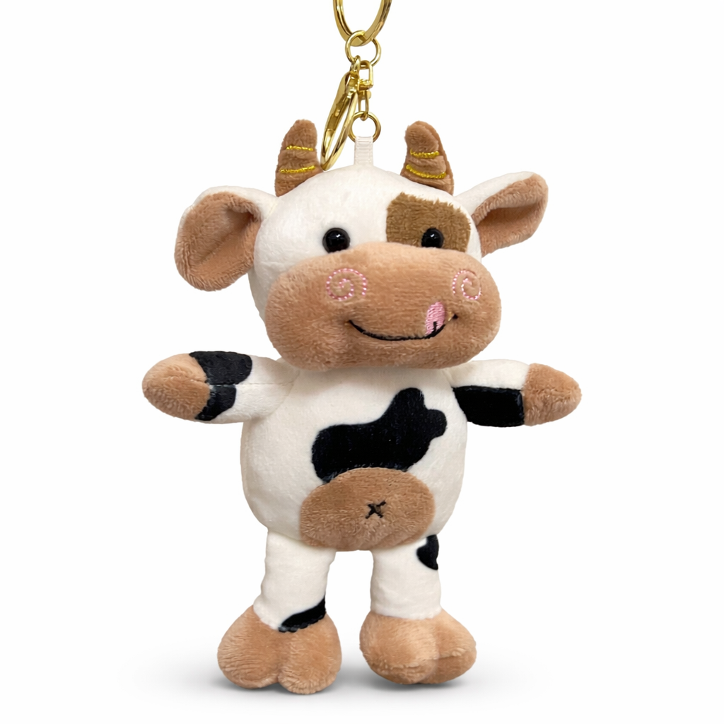 Givana cute plush cow keychain with golden clasp, soft fabric, and detailed cow features for attaching to keys or bags.