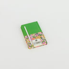 Floral A6 notebook by 2BE featuring a vibrant flower pattern on a soft cover, ideal for notes and sketches.