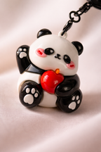 Givana Panda Pop keychain featuring a cute panda design, available in four charming styles, attached to a keyring.