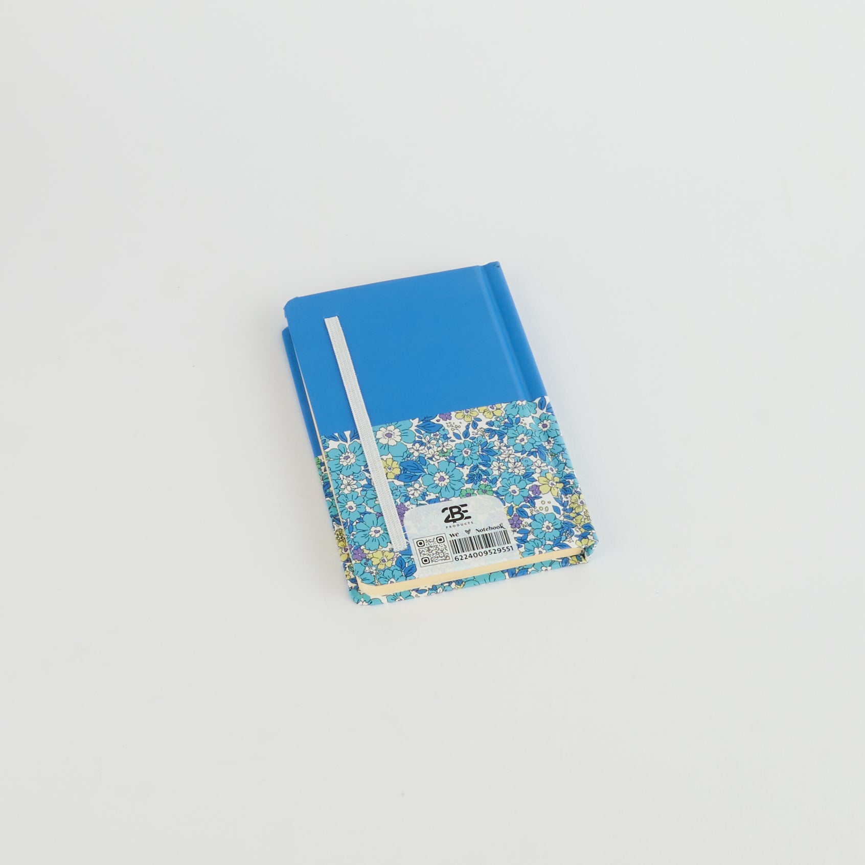Floral A6 notebook by 2BE featuring a vibrant flower design on a softcover. Ideal for notes and journaling.