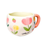 Givana mug featuring a sleek design with a comfortable handle and vibrant colors, perfect for hot beverages.