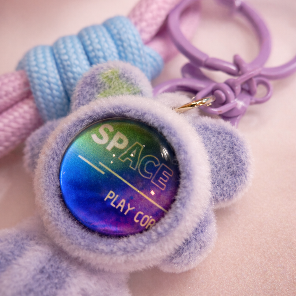 Colorful Space Bear keychain by Givana featuring a cute bear design in four vibrant colors, perfect for accessorizing keys or bags.
