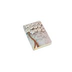 A6 floral notebook by 2BE featuring a colorful flower design on a textured cover.