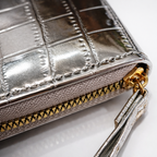 Givana Croco Shine Zip Wallet in black with silver zipper, featuring a glossy crocodile texture and compact design.
