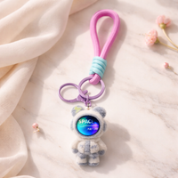 Colorful Space Bear keychain by Givana featuring a cute bear design in four vibrant color options.
