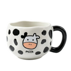 Givana ceramic mug featuring a playful cow pattern, perfect for coffee or tea, with a glossy finish and comfortable handle.