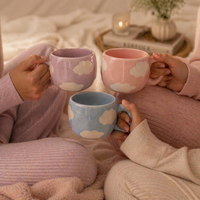 Givana Cloudy Dreams mug with pastel cloud design in five colors, ceramic coffee cup with soft, dreamy artwork.