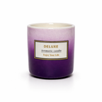 Givana DELUXE Aromatic Candle in two shades, featuring a glass container with a lit flame and elegant design.