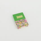 A6 floral notebook by 2BE featuring colorful flower patterns on a textured cover.