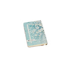 A6 floral notebook by 2BE featuring a colorful flower design on the cover, ideal for notes and sketches.