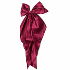 Givana bow hair clip in vibrant color, featuring a stylish design suitable for all hair types and occasions.
