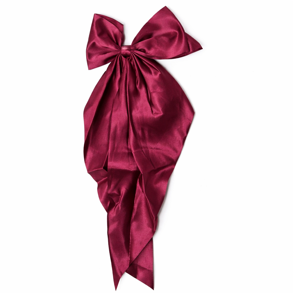 Givana bow hair clip in vibrant color, featuring a stylish design suitable for all hair types and occasions.