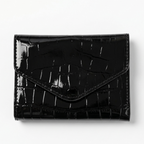 Givana leather wallet with magnet closure, showing sleek brown leather exterior and compact design.