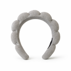 Givana Puffy Spa Skincare Headband in soft pink, made of plush fabric, designed to keep hair away during skincare routines