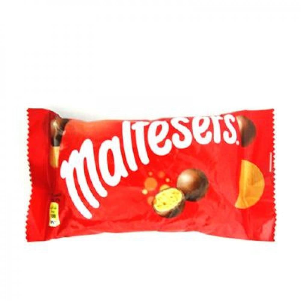 Round chocolate-covered Maltesers from Carrefour in a bright packaging, showcasing the delicious malt-filled treats.