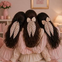 Cherry Babe Clip-On Bow by Givana in four colors, featuring a cute cherry design on a stylish hair accessory.