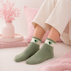 Colorful Givana Lucky Mood Socks with green accents, featuring five different playful designs on soft fabric.