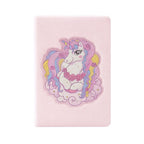 A5 notebook with a fur cover, featuring the brand 2BE, displayed on a wooden surface.