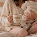 Givana Mum Hug Mug with heart design, limited edition ceramic mug for moms, featuring a cozy, love-themed illustration.