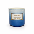 Givana Deluxe Aromatic Candle in two shades with a warm glow and elegant design, perfect for creating a cozy atmosphere.