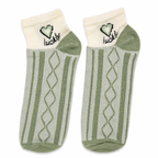 Pair of Lucky Mood Socks by Givana in vibrant green with five playful design options, showcasing cozy, colorful sock styles.